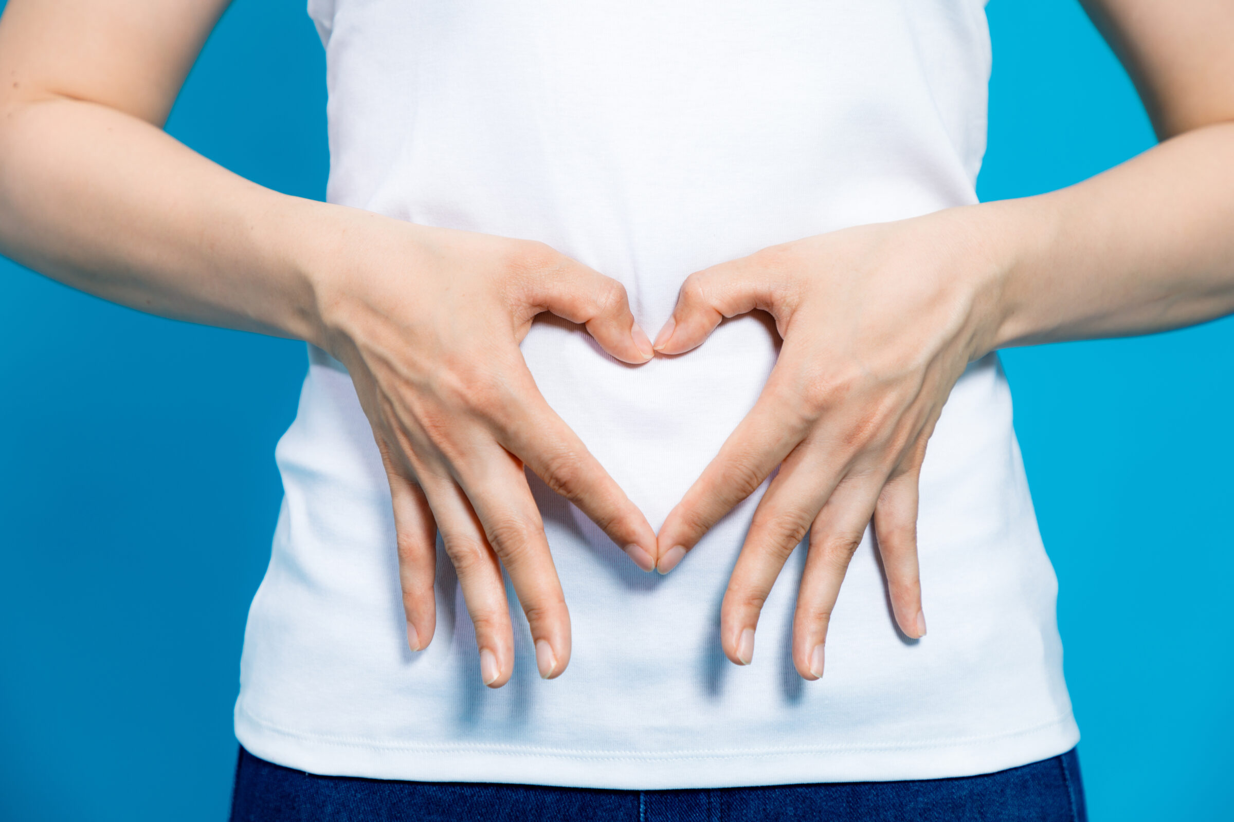 woman with a heart in front of her stomach